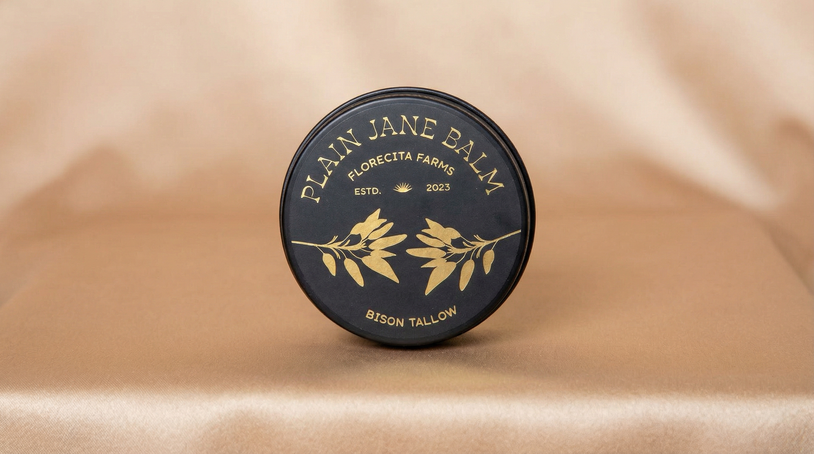 Studio shot of Plain Jane Balm on satin surface